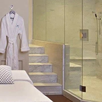 spa treatment room photo with marble shower